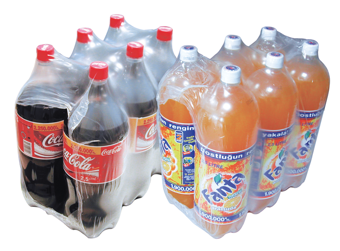 a group of plastic bottles with red caps